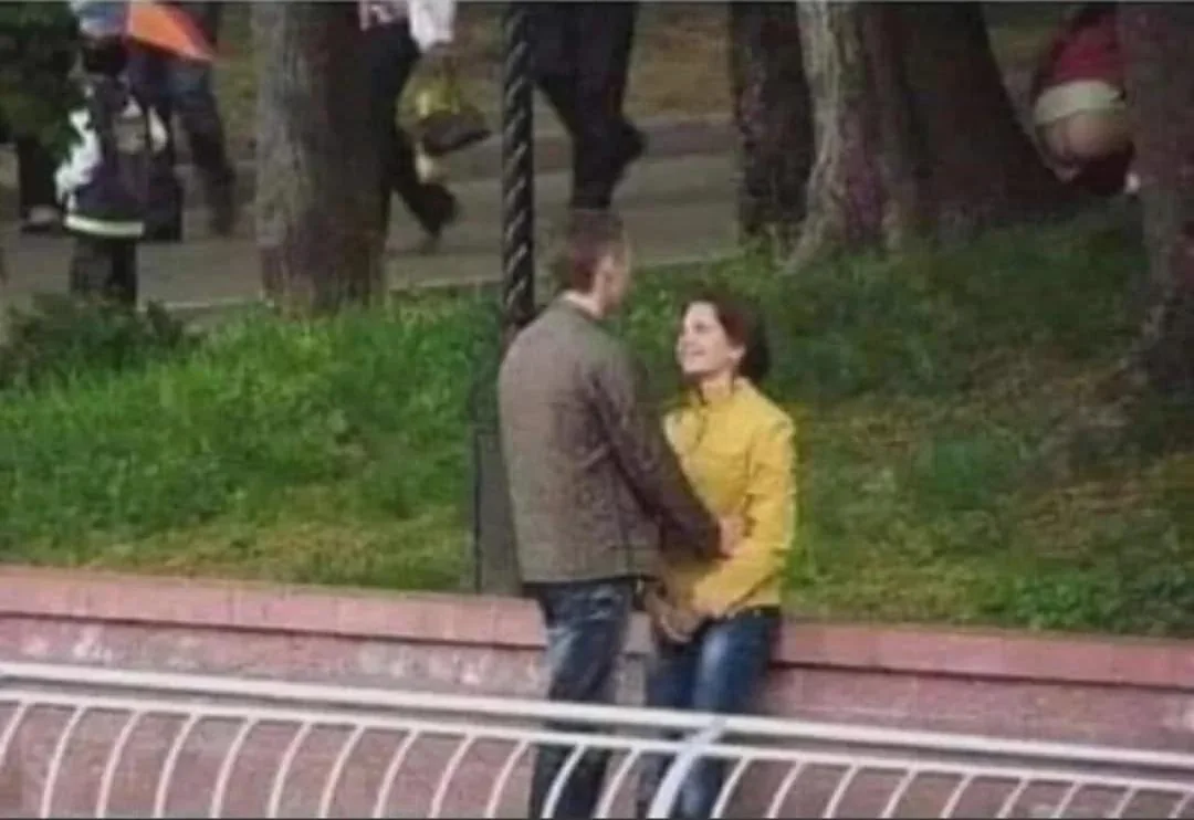 Open couple strolling park